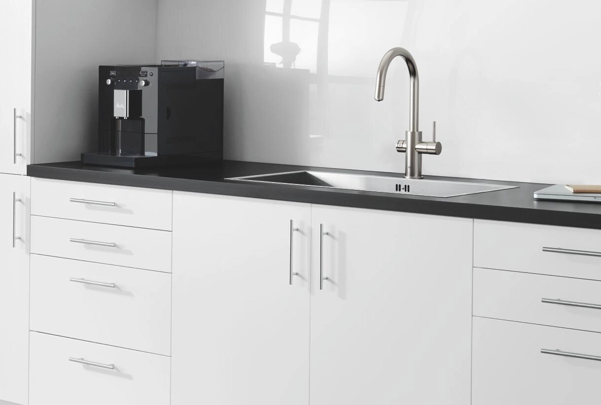 GROHE Blue showroom in Dubai with kitchen taps displayed on stone worktops