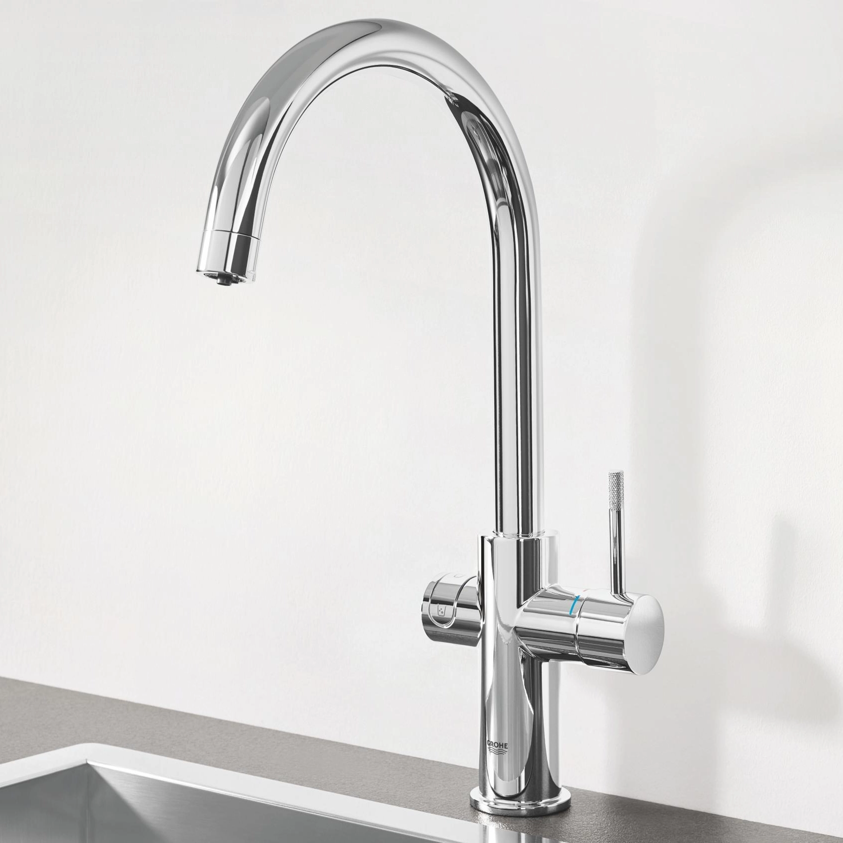 Complete GROHE Blue Pure system: chrome kitchen tap with a compact under-sink filter housing
